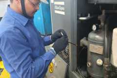 technician-operating-air-compressor.jpg